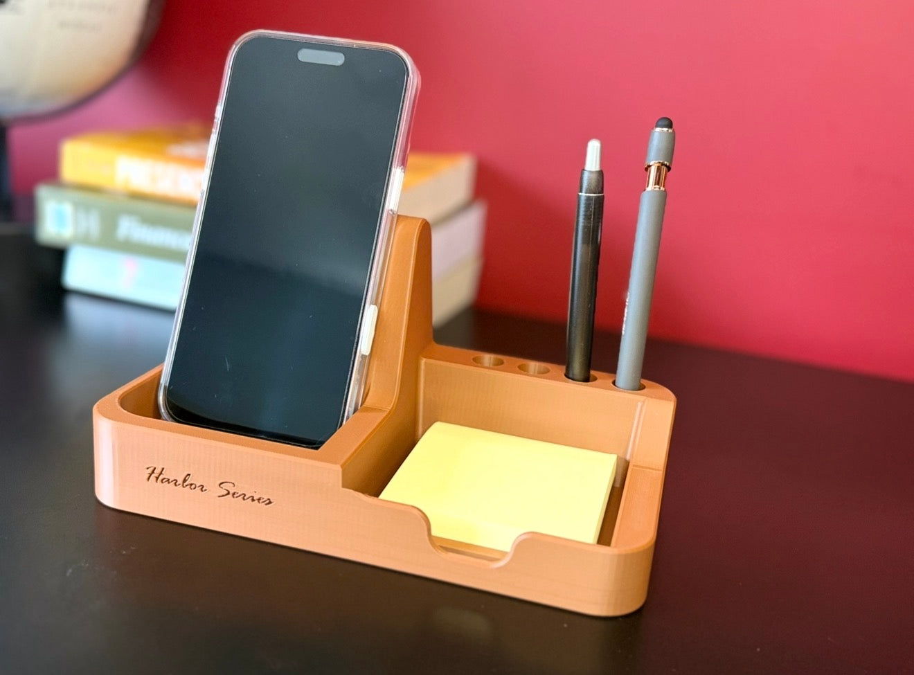 Harbor Dock desk organizer in Earth Brown with phone stand and pen dock on a clean desk

